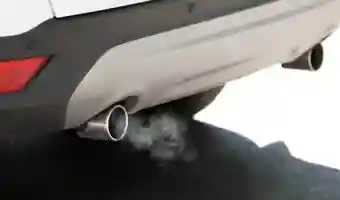 closeup of an exhaust pipe blowing out exhaust